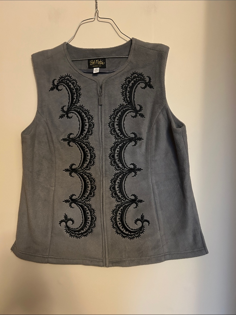 Bob Mackie grey fleece with black trim vest in very good condition size M